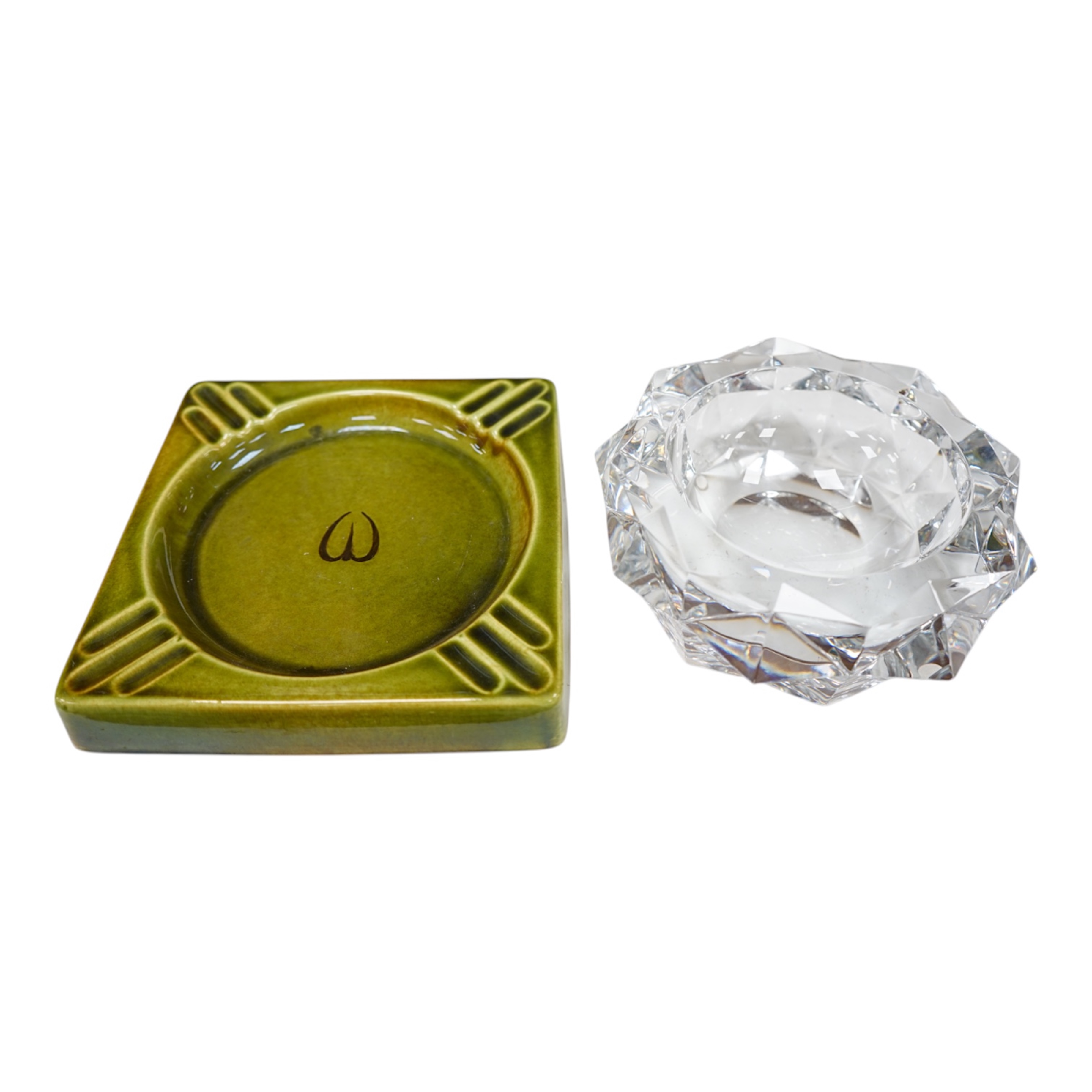 A Baccarat cut glass ashtray, 19cm diameter, and a Gefle Swedish green pottery ashtray, 20cm wide. Condition - good.